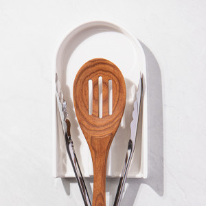 Alto Serve and Share Tong and Spoon Rest, a functional utensil for food preparation, serving or household use